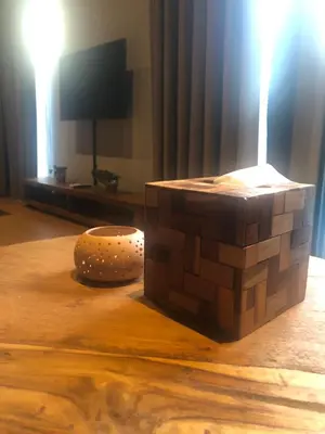 a wooden block sitting on top of a table at Rumah Kahyangan in Canggu