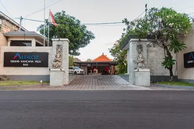 an entrance to a building with a sign on it at Aldeoz Grand Kancana Villas Resort Bali in Kerobokan