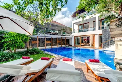 a swimming pool in the backyard of a house at Villa De Jiwa 495 Seminyak in Seminyak