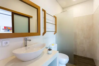 a bathroom with a sink and a toilet at Pondok Bobo Seminyak in Seminyak