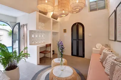 a living room with a couch and a table at Seminyak Beach Bungalow Studio Villa 1 with private pool SBB1 in Seminyak
