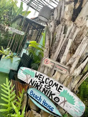 a sign that says welcome to a beach house at NIKINIKO Beach House by Lolavillas - 100mts to the beach in Canggu