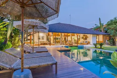 a villa with a swimming pool and a resort at Tropical 5BR Villa & 20m Pool, Sleeps 12 in Seminyak