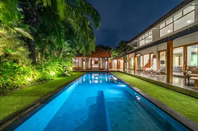 an image of a swimming pool in the backyard of a house at Villa Litera Canggu Bali in Canggu