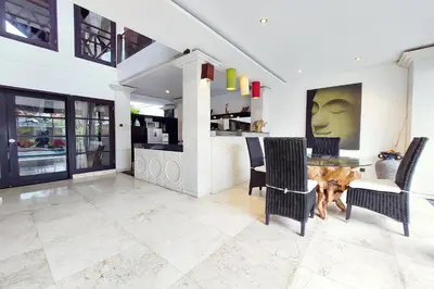 a dining room with a table and chairs at Harmony Villa Dua in Seminyak