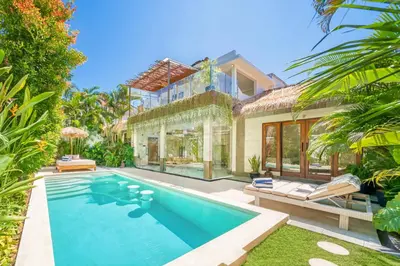 an exterior view of a house with a swimming pool at Villa Florence - 3BDR Luxury Villa, Private Pool, Walk to the Beach in Seminyak