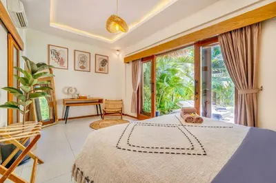 a bedroom with a bed and a large window at Villa Florence - 3BDR Luxury Villa, Private Pool, Walk to the Beach in Seminyak