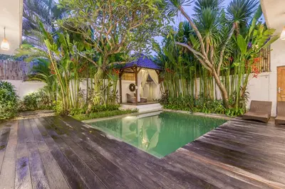 a house with a swimming pool with a gazebo at Pulesari 2 bedrooms in Seminyak