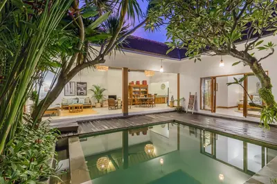 an indoor swimming pool in a villa at Pulesari 2 bedrooms in Seminyak