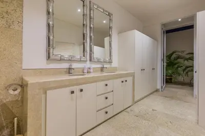 a bathroom with a sink and a mirror at Villa Lansel in Seminyak