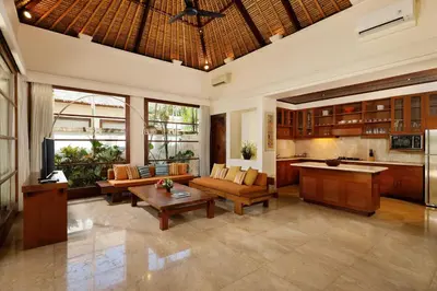 a living room with a couch and a table at Jimbaran Beach Villas by Nakula in Jimbaran
