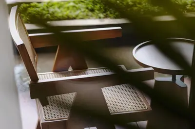 a view of a table and chairs from a window at Beachwalk Residence in Kuta