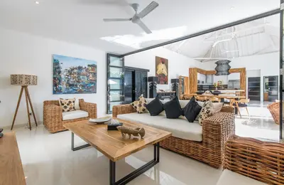 a living room with a couch and a table at Villa Lora in Seminyak