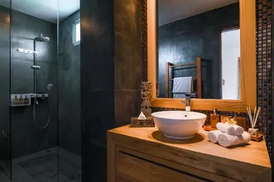 a bathroom with a sink and a shower at Cascata Villa Canggu in Canggu