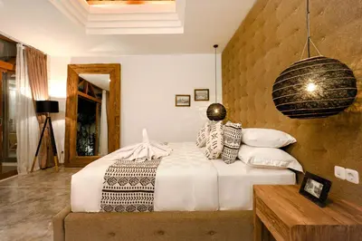 a bedroom with a bed in a room at Cascata Villa Canggu in Canggu