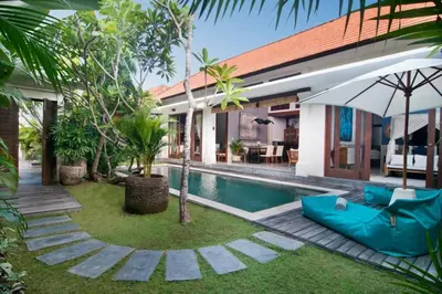 a villa with a swimming pool and a house at 2BR Villa Violetta - Minggu Villas - Special Stay Bonus in Kerobokan