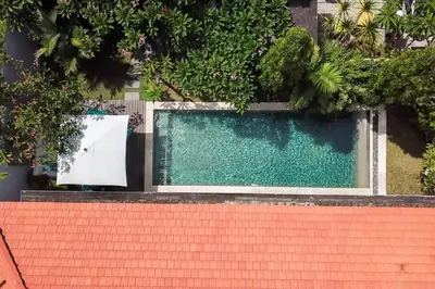 an overhead view of a swimming pool with a red roof at 2BR Villa Violetta - Minggu Villas - Special Stay Bonus in Kerobokan