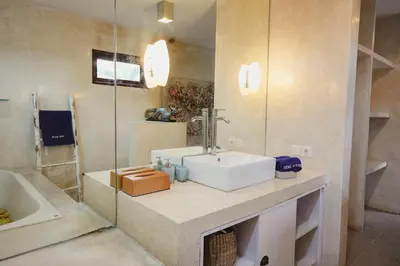 a bathroom with a sink and a shower at Villa Dewi in Seminyak