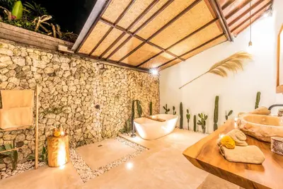 a bathroom with a sink and a toilet and a tub at Villa Toscana - 7 BDR Luxury Villa with private pool in Seminyak