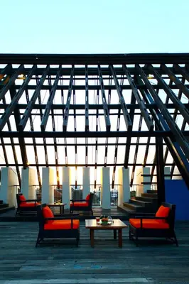 a group of chairs and tables on a roof at Sun Island Hotel & Spa Legian in Legian
