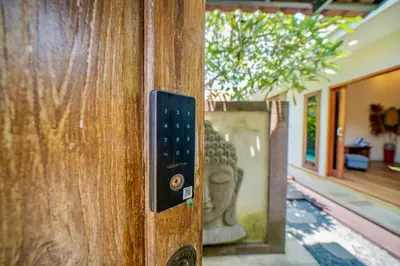 a close up of a door with a statue at Villa Paradise Seminyak in Seminyak