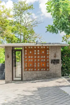 a building with a door with graffiti on it at La Maison d'Ulysse - Luxury 4-Bedroom Villa with Pool in Canggu in Kerobokan