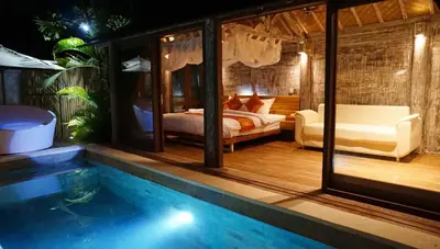 a bedroom with a bed and a swimming pool at PROMO Private Vacation Rental Villa 2 Pools 4 Bedrooms 4 Bathrooms Free Scooter up to 3 scooters in Seminyak