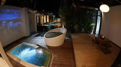 a pool on a deck with a chair and a table at PROMO Private Vacation Rental Villa 2 Pools 4 Bedrooms 4 Bathrooms Free Scooter up to 3 scooters in Seminyak
