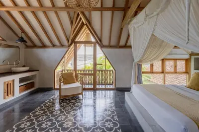 a bedroom with a bed and a large window at Villa Palm Jari 1 by Alfred in Bali in Canggu
