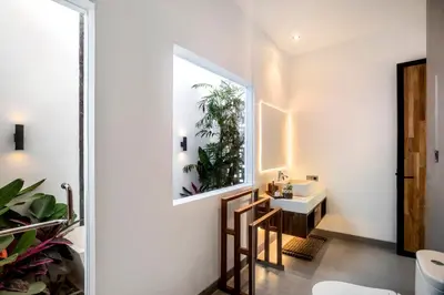a bathroom with a sink and a mirror at Villa Australis in Kerobokan