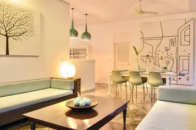 a living room with a couch and a table at Villa Lola in Seminyak
