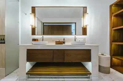 a bathroom with two sinks and a mirror at Villa Reillo Canggu in Canggu