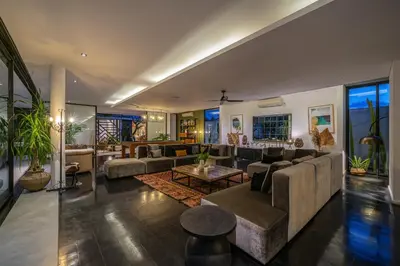 a large living room with couches and a table at Villa Bull House Amazing 6 bedrooms contemporary villa in Seminyak in Seminyak