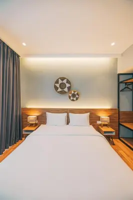 a bedroom with a large white bed in a room at Bestah Coliving in Sanur