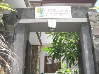 a sign for the entrance to a building at Pondok Mirah in Kuta