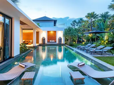 a swimming pool in the backyard of a house at Villa Castil di Udara by Villa Finder in Kerobokan