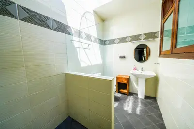 a bathroom with a sink and a mirror at Villa SANKET - KUTA - 6 bedrooms - 6 bathrooms - Great Location in Kuta
