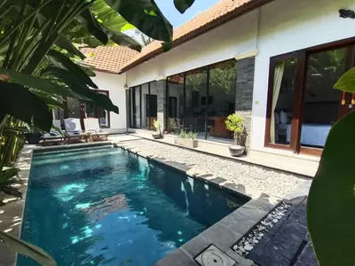 a swimming pool in the backyard of a house at Villa CRIS - Heart of LEGIAN 3 Bedrooms, 3 Bathrooms in Legian