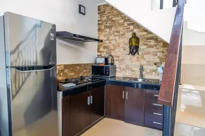 a kitchen with a stainless steel refrigerator and a sink at OASIS 66 Villa - Heart of Legian/Seminyak - Double Six in Seminyak
