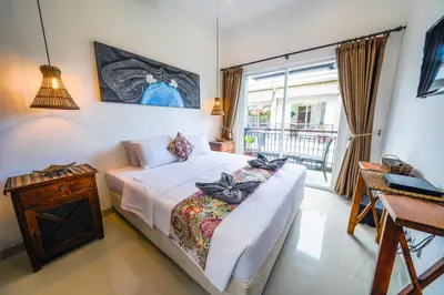 a bedroom with a bed and a window at OASIS 66 Villa - Heart of Legian/Seminyak - Double Six in Seminyak