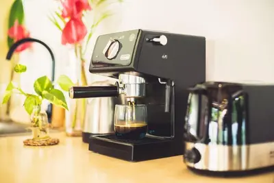 a black coffee maker sitting on top of a counter at Villa Baladeva - 5 BDR Luxury Villa with huge private Pool in Kuta
