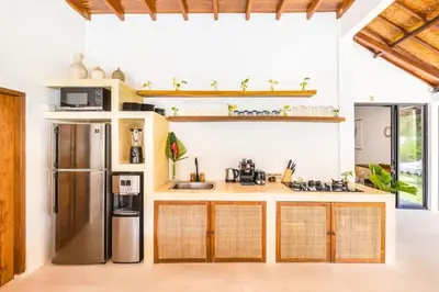 a kitchen with a stainless steel refrigerator at Villa Baladeva - 5 BDR Luxury Villa with huge private Pool in Kuta
