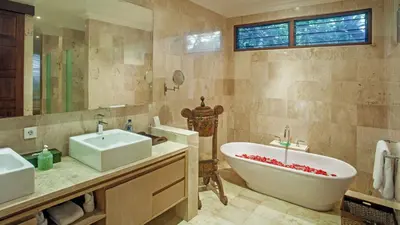 a bathroom with two sinks and a bath tub at Villa Avalon by Elite Havens in Canggu