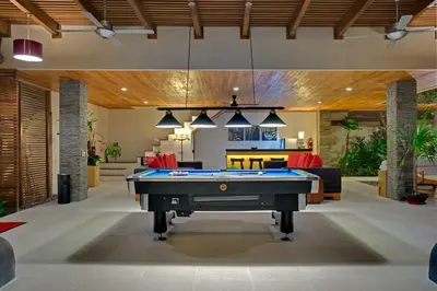 a pool table in the middle of a living room at Villa Kinaree Estate in Seminyak
