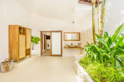 an open hallway with plants in a house at Villa Tokyo - 3 BDR Private Villa - 3 min walk to KU DE TA beach in Kuta