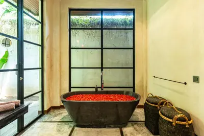 a large bath tub in a room with a window at PROMO Large Astonishing 5 BR Luxury Private Villa in Canggu