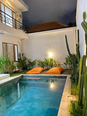 a swimming pool in the backyard of a house at Villa Akmali Seminyak Basangkasa- 2 Bedrooms in Seminyak