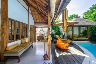 an outdoor patio with a slide and a swimming pool at Villa Kainara Seminyak by RPM in Seminyak