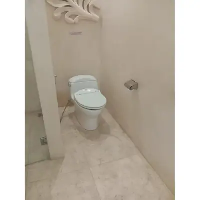 a bathroom with a white toilet in a stall at Aldeoz Villa Nusa Dua in Nusa Dua