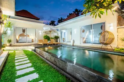 a swimming pool in the backyard of a villa at Villa Luna Rose in Seminyak